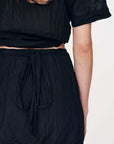 Rowie Jole Silk Mini Wrap Skirt Noir